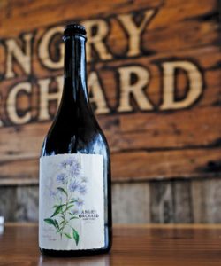 View of Angry Orchard Hard Cider bottle.