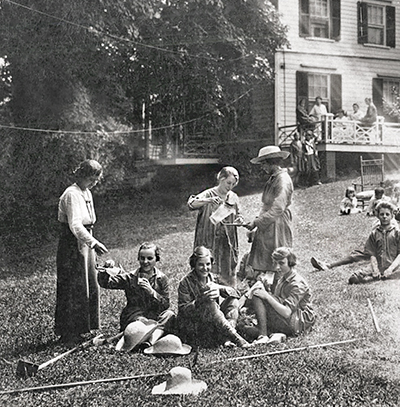 vintage black and white photo of women seated on grass