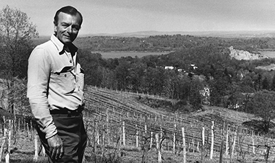 black and white vintage image of Mark Miller overlooking vinyard