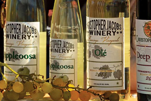 white wine bottles in a row