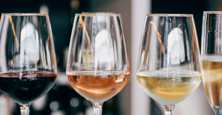 four wine glasses in a row