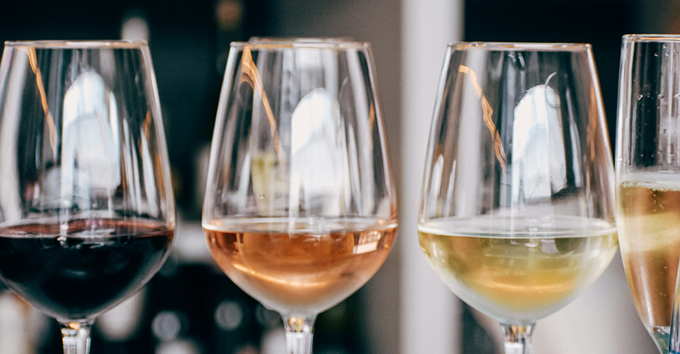 four wine glasses in a row