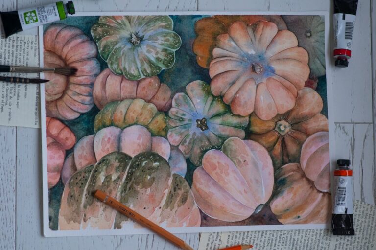 hand-painted patterned and pastel pumpkins on a rustic wooden table